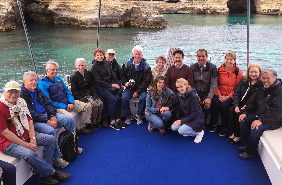A group of people sitting on top of a boat.
