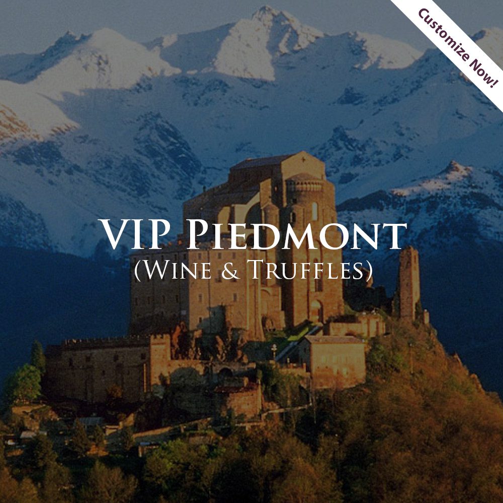 A picture of a castle with mountains in the background.